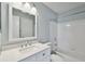 Bathroom with tub, toilet and vanity with quartz countertop at 9481 Highland Oak Dr # 1615, Tampa, FL 33647