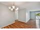 Dining area with wood flooring and chandelier, near kitchen at 9481 Highland Oak Dr # 1615, Tampa, FL 33647