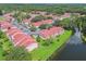 Aerial view of a large condo community near a lake at 9481 Highland Oak Dr # 1615, Tampa, FL 33647