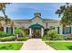 Community clubhouse with inviting entryway and landscaping at 5134 Northridge Rd # 309, Sarasota, FL 34238