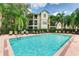 Inviting community pool with surrounding lounge chairs at 5134 Northridge Rd # 309, Sarasota, FL 34238