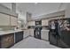 Efficient kitchen with black appliances and light wood cabinets at 17721 Ridgeway Point Pl, Tampa, FL 33647