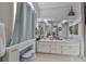 Bathroom boasts double vanity and updated fixtures at 17721 Ridgeway Point Pl, Tampa, FL 33647