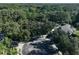 Aerial view showing home's location in a wooded neighborhood at 17721 Ridgeway Point Pl, Tampa, FL 33647