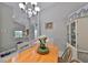 Spacious dining area with a light wood table and view to kitchen at 17721 Ridgeway Point Pl, Tampa, FL 33647