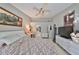 Main bedroom with a king size bed and ensuite bathroom access at 17721 Ridgeway Point Pl, Tampa, FL 33647
