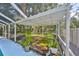 Screened-in pool deck with wooden flooring and plants at 17721 Ridgeway Point Pl, Tampa, FL 33647