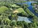 Aerial view of community amenities: tennis courts, baseball field at 17721 Ridgeway Point Pl, Tampa, FL 33647