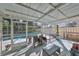 Relaxing screened-in pool area with patio furniture at 17721 Ridgeway Point Pl, Tampa, FL 33647