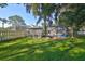 Spacious backyard with screened pool and lush landscaping at 17721 Ridgeway Point Pl, Tampa, FL 33647