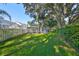 Spacious backyard with lush lawn, trees, and pool at 17721 Ridgeway Point Pl, Tampa, FL 33647