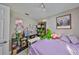 Charming bedroom with a double bed and Muppet themed decor at 17721 Ridgeway Point Pl, Tampa, FL 33647