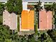 Aerial view of three homes with terracotta roofs and lush landscaping at 5417 83Rd E Ter, Sarasota, FL 34243