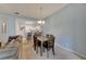 Bright dining room with a table and chairs, adjacent to the kitchen at 1015 Radison Lake Ct # 65, Sun City Center, FL 33573