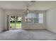 Bright bedroom with sliding glass doors leading to the backyard at 1015 Radison Lake Ct # 65, Sun City Center, FL 33573