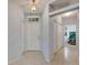 Light and airy entryway with tile flooring, coat closets, and access to other rooms at 1015 Radison Lake Ct # 65, Sun City Center, FL 33573