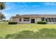 Large backyard with lush grass and a partially visible patio at 1015 Radison Lake Ct # 65, Sun City Center, FL 33573