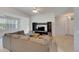 Spacious living area with sectional sofa, coffee table, and entertainment center at 1015 Radison Lake Ct # 65, Sun City Center, FL 33573