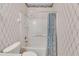 Clean bathroom with shower/tub combo and nautical-themed wallpaper at 1015 Radison Lake Ct # 65, Sun City Center, FL 33573