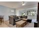 Spacious living room with sectional sofa, coffee table, and access to backyard at 1015 Radison Lake Ct # 65, Sun City Center, FL 33573