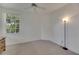 Spacious bedroom with large window and ceiling fan at 1015 Radison Lake Ct # 65, Sun City Center, FL 33573