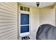 Front door entry with a welcome mat and grill at 1015 Radison Lake Ct # 65, Sun City Center, FL 33573