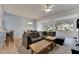 Open concept living area with sectional sofa, dining table, and view of the backyard at 1015 Radison Lake Ct # 65, Sun City Center, FL 33573