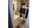 Clean bathroom with white vanity, shower, and geometric shower curtain at 6115 7Th Ave, New Port Richey, FL 34653