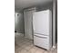 White Whirlpool refrigerator in a kitchen with tile floors and a closet at 6115 7Th Ave, New Port Richey, FL 34653
