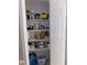 Well-organized pantry with ample shelving for food storage at 6115 7Th Ave, New Port Richey, FL 34653