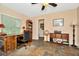 A functional home office featuring a classic wooden desk and ample storage at 7242 Alafia Ridge Loop, Riverview, FL 33569