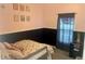 Charming bedroom with pink walls and floral bedding at 26638 Green Willow Run, Wesley Chapel, FL 33544
