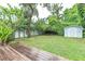 Large backyard with grassy area and storage shed at 1837 Worrington St, Sarasota, FL 34231