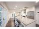Spacious kitchen with large island, stainless steel appliances, and hardwood floors at 1837 Worrington St, Sarasota, FL 34231