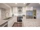 Modern kitchen with stainless steel appliances and granite countertops at 1837 Worrington St, Sarasota, FL 34231