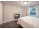 Bedroom with a gas fireplace and dark hardwood floors at 1837 Worrington St, Sarasota, FL 34231