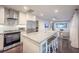 Open kitchen boasts an island with seating and stainless steel appliances at 1837 Worrington St, Sarasota, FL 34231