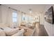 Open living room with hardwood floors, white walls, and kitchen view at 1837 Worrington St, Sarasota, FL 34231