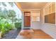 Inviting front door entrance with a wooden deck at 1837 Worrington St, Sarasota, FL 34231