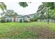 Large backyard with lush green grass and a playset at 1837 Worrington St, Sarasota, FL 34231