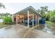 Covered carport with space for one car and additional storage at 1837 Worrington St, Sarasota, FL 34231
