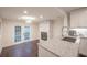 Kitchen area with dining space, fireplace, and french doors to backyard at 1837 Worrington St, Sarasota, FL 34231