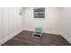 Small room with dark hardwood floors and white walls at 1837 Worrington St, Sarasota, FL 34231