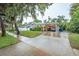 House exterior view, showcasing the carport and landscaping at 1837 Worrington St, Sarasota, FL 34231