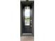 Black front door with glass panel and brass accents at 13292 Sea Bridge Dr, Hudson, FL 34669