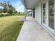 Long covered patio with access to backyard at 13292 Sea Bridge Dr, Hudson, FL 34669