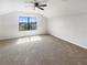 Bright bedroom with large window and carpet flooring at 13292 Sea Bridge Dr, Hudson, FL 34669