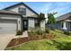 One story home with gray siding and two car garage at 13292 Sea Bridge Dr, Hudson, FL 34669