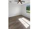 Spacious bedroom with wood-look flooring and a large window at 13292 Sea Bridge Dr, Hudson, FL 34669