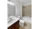 Clean bathroom with a bathtub, toilet and sink at 13292 Sea Bridge Dr, Hudson, FL 34669